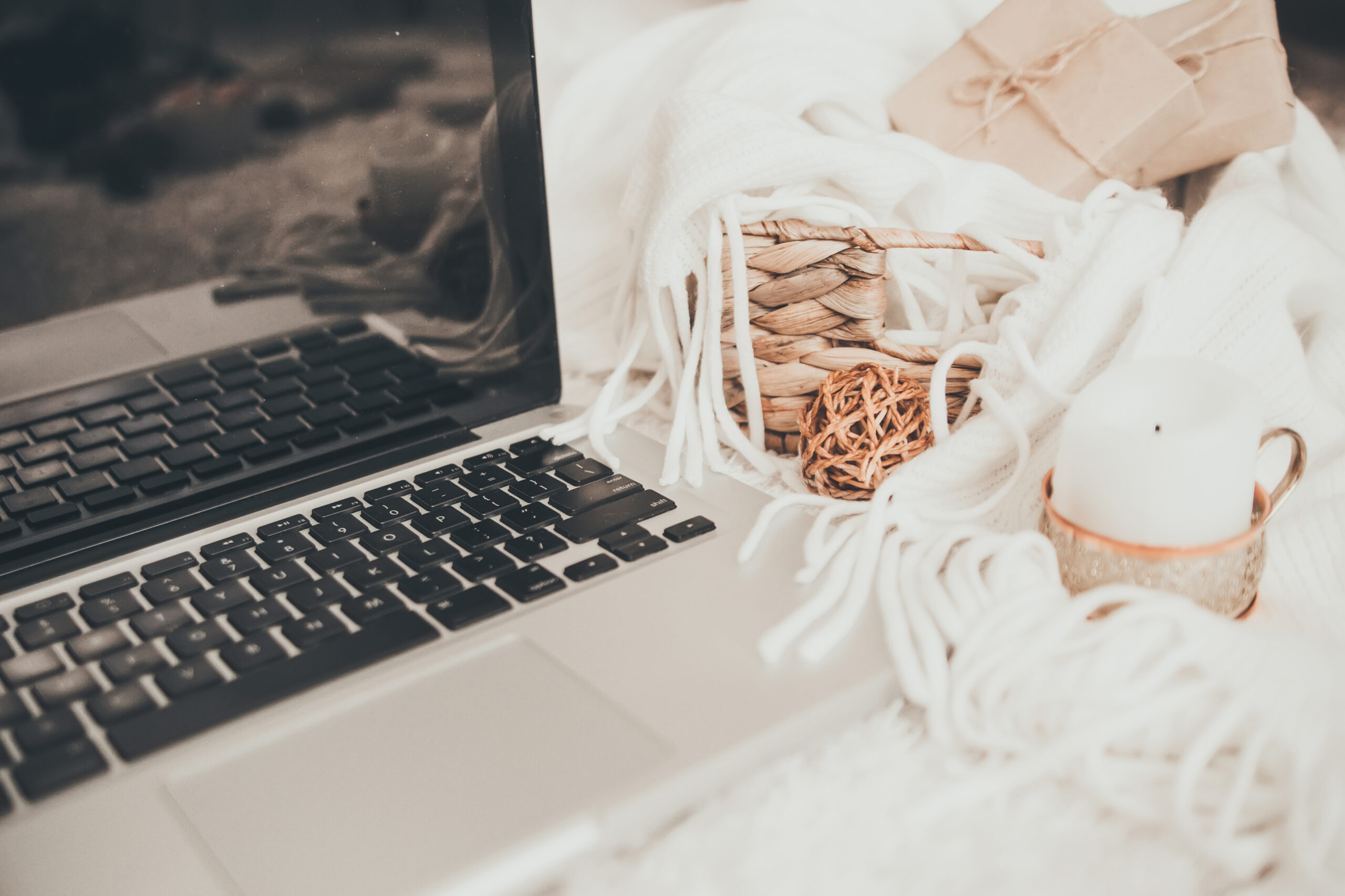 Cozy working atmosphere with laptop. Home comfort concept.